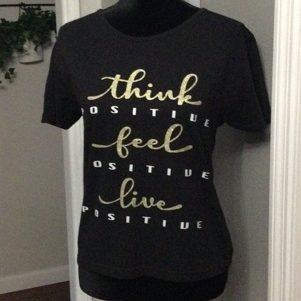 Black top with print words and open back